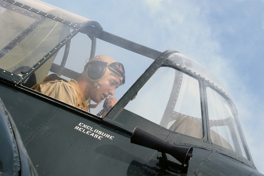 Pilot looking out of the cockpit of an airplane