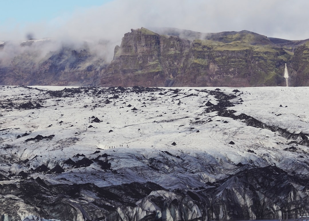 Glacier landscape with mountains and mist