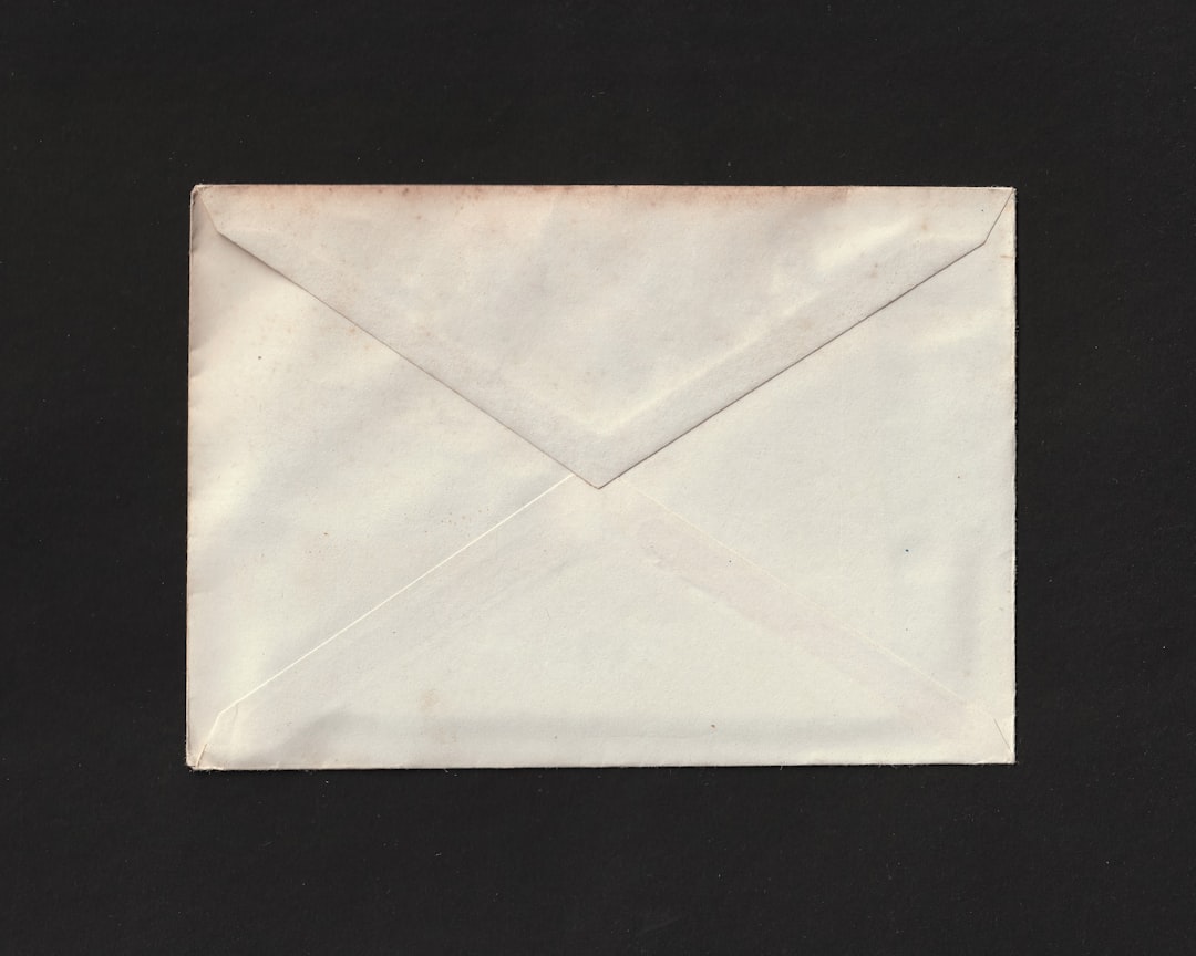 A white envelope on a black background