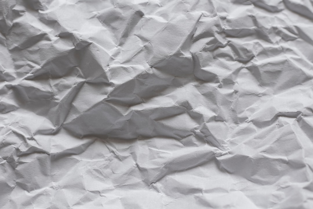 white paper on white textile