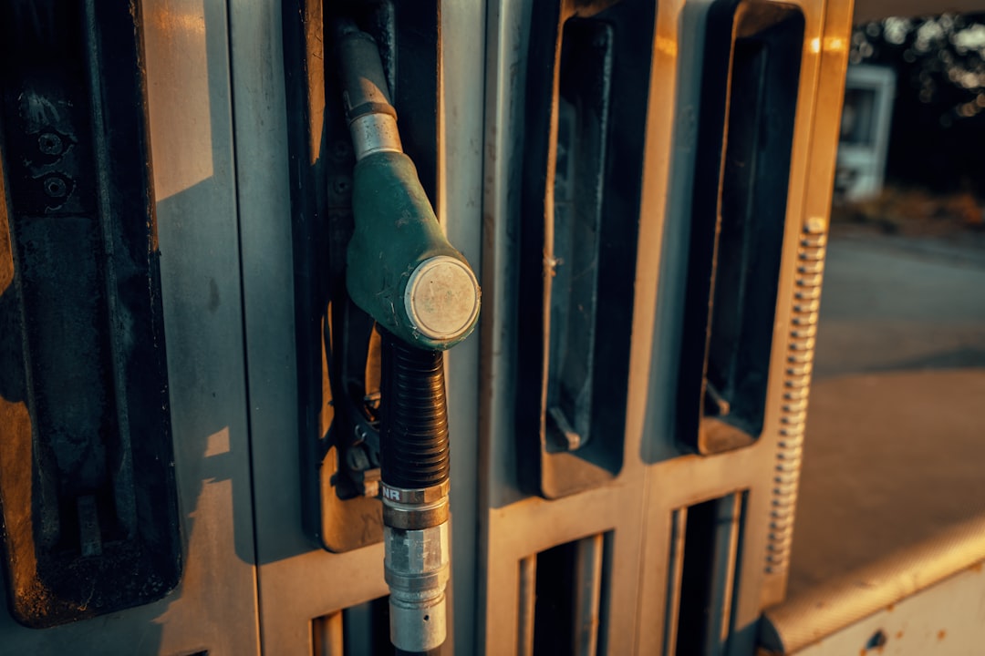 A close-up of a gas pump nozzle at a station