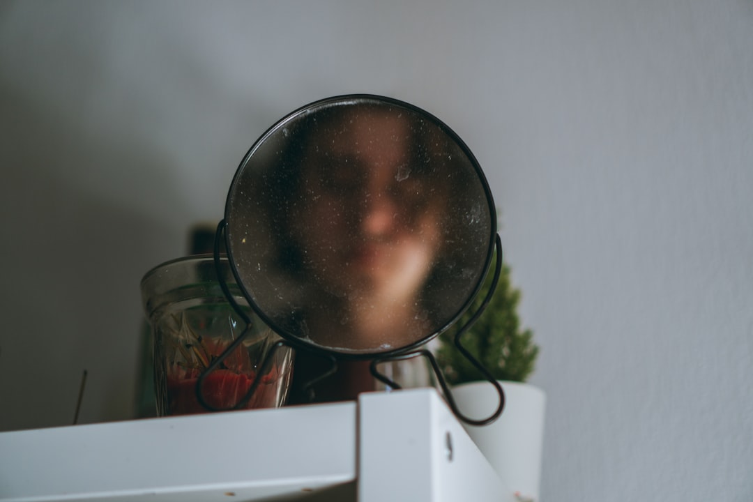 a close up of a magnifying glass on a shelf